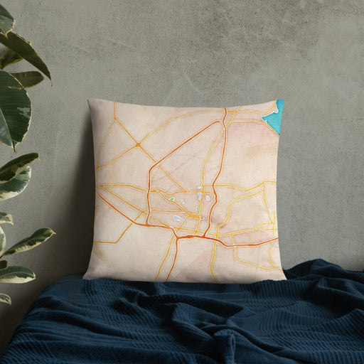 Custom Jackson Mississippi Map Throw Pillow in Watercolor on Bedding Against Wall
