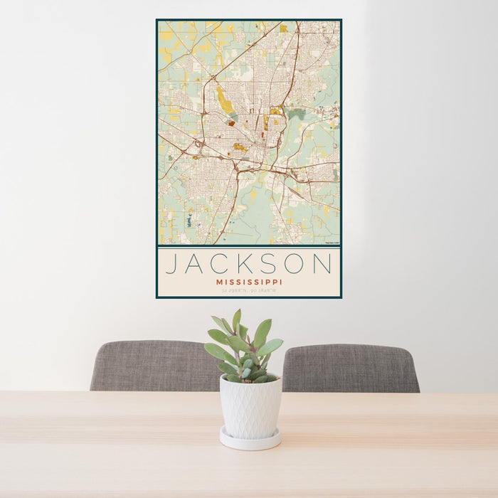 24x36 Jackson Mississippi Map Print Portrait Orientation in Woodblock Style Behind 2 Chairs Table and Potted Plant