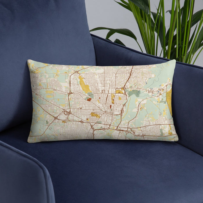 Custom Jackson Mississippi Map Throw Pillow in Woodblock on Blue Colored Chair