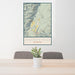 24x36 Jackson Hole Wyoming Map Print Portrait Orientation in Woodblock Style Behind 2 Chairs Table and Potted Plant