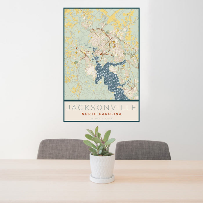 24x36 Jacksonville North Carolina Map Print Portrait Orientation in Woodblock Style Behind 2 Chairs Table and Potted Plant