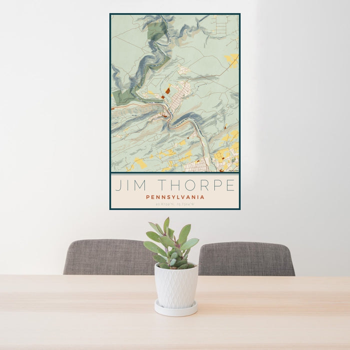 24x36 Jim Thorpe Pennsylvania Map Print Portrait Orientation in Woodblock Style Behind 2 Chairs Table and Potted Plant