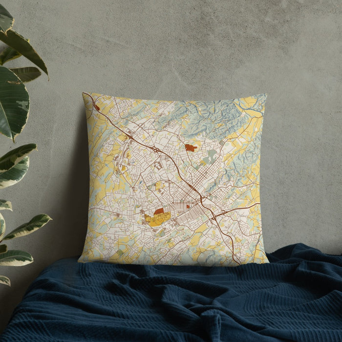 Custom Johnson City Tennessee Map Throw Pillow in Woodblock on Bedding Against Wall