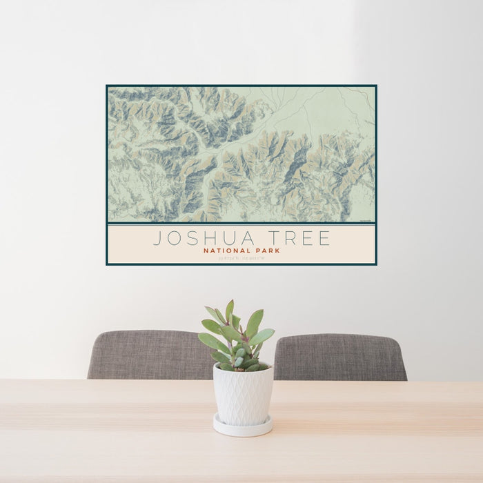 24x36 Joshua Tree National Park Map Print Landscape Orientation in Woodblock Style Behind 2 Chairs Table and Potted Plant
