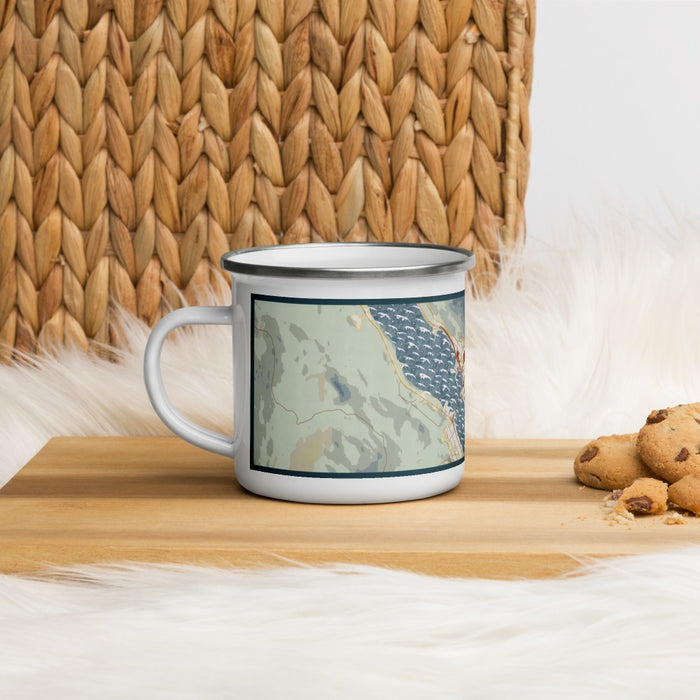 Left View Custom Juneau Alaska Map Enamel Mug in Woodblock on Table Top