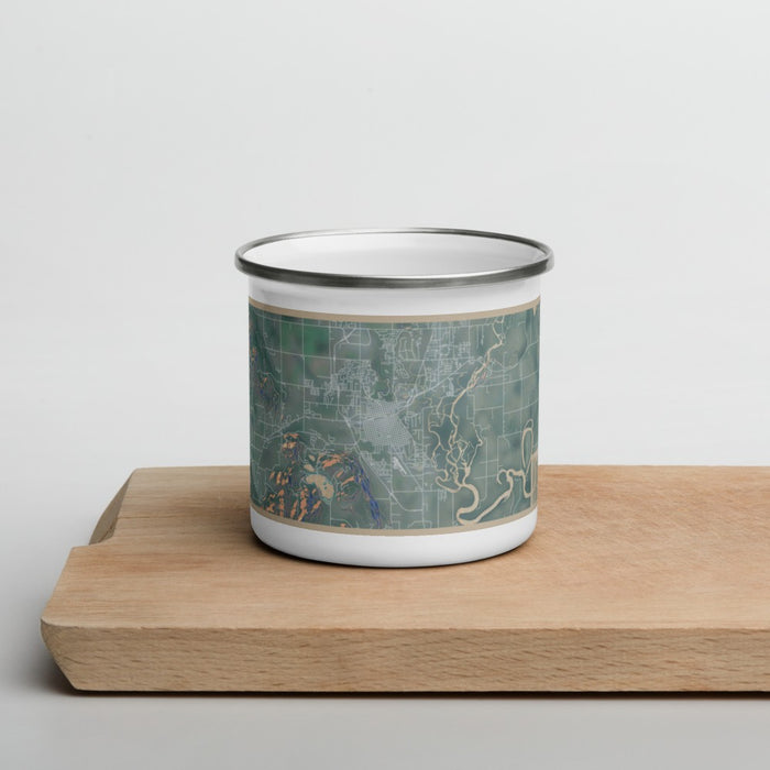 Front View Custom Kalispell Montana Map Enamel Mug in Afternoon on Cutting Board