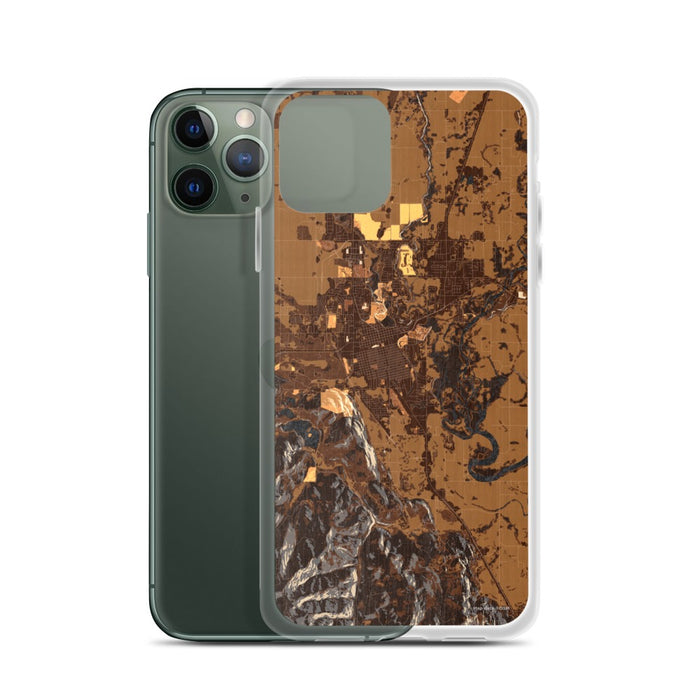 Custom Kalispell Montana Map Phone Case in Ember on Table with Laptop and Plant