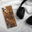 Custom Kalispell Montana Map Phone Case in Ember on Table with Black Headphones