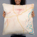Person holding 22x22 Custom Kalispell Montana Map Throw Pillow in Watercolor