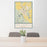 24x36 Kalispell Montana Map Print Portrait Orientation in Woodblock Style Behind 2 Chairs Table and Potted Plant