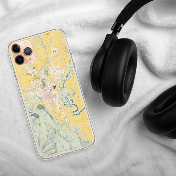 Custom Kalispell Montana Map Phone Case in Woodblock on Table with Black Headphones