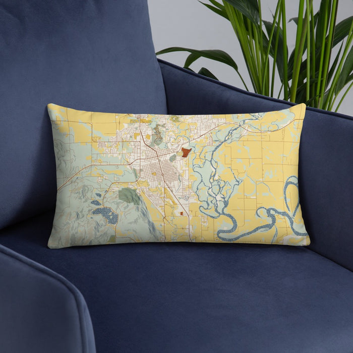 Custom Kalispell Montana Map Throw Pillow in Woodblock on Blue Colored Chair