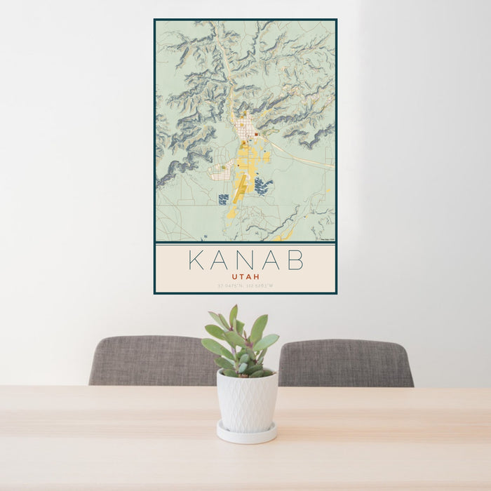24x36 Kanab Utah Map Print Portrait Orientation in Woodblock Style Behind 2 Chairs Table and Potted Plant