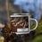 Right View Custom Kanab Utah Map Enamel Mug in Ember on Grass With Trees in Background