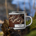 Right View Custom Kanab Utah Map Enamel Mug in Ember on Grass With Trees in Background