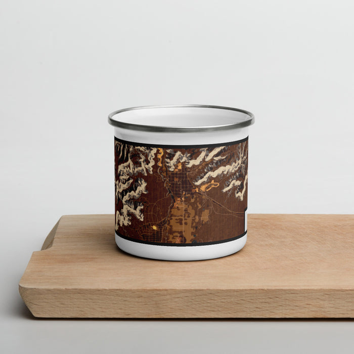 Front View Custom Kanab Utah Map Enamel Mug in Ember on Cutting Board