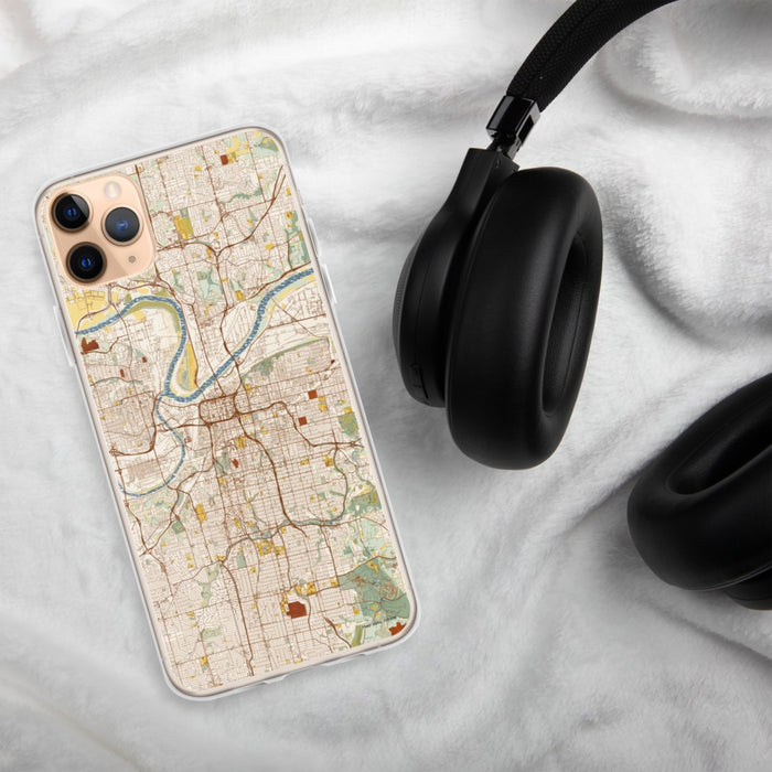 Custom Kansas City Missouri Map Phone Case in Woodblock on Table with Black Headphones