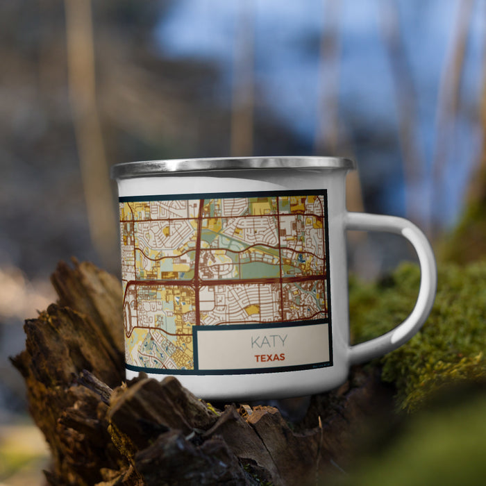 Right View Custom Katy Texas Map Enamel Mug in Woodblock on Grass With Trees in Background