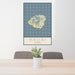 24x36 Kauai Hawaii Map Print Portrait Orientation in Woodblock Style Behind 2 Chairs Table and Potted Plant