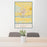 24x36 Kearney Nebraska Map Print Portrait Orientation in Woodblock Style Behind 2 Chairs Table and Potted Plant