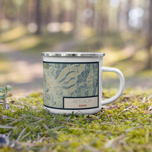 Right View Custom Ketchum Idaho Map Enamel Mug in Woodblock on Grass With Trees in Background