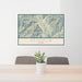 24x36 Ketchum Idaho Map Print Landscape Orientation in Woodblock Style Behind 2 Chairs Table and Potted Plant