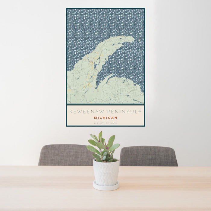 24x36 Keweenaw Peninsula Michigan Map Print Portrait Orientation in Woodblock Style Behind 2 Chairs Table and Potted Plant