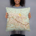 Person holding 18x18 Custom Killeen Texas Map Throw Pillow in Woodblock