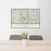 24x36 Killington Vermont Map Print Landscape Orientation in Woodblock Style Behind 2 Chairs Table and Potted Plant