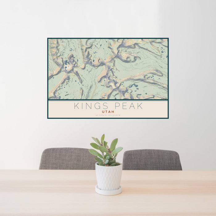24x36 Kings Peak Utah Map Print Lanscape Orientation in Woodblock Style Behind 2 Chairs Table and Potted Plant