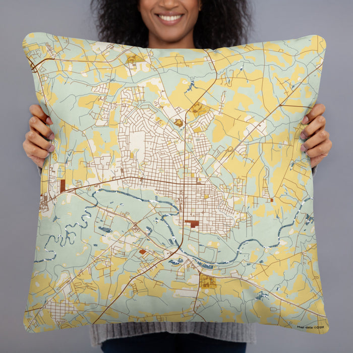 Person holding 22x22 Custom Kinston North Carolina Map Throw Pillow in Woodblock