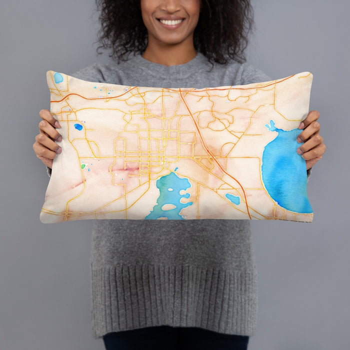 Person holding 20x12 Custom Kissimmee Florida Map Throw Pillow in Watercolor