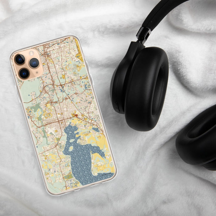 Custom Kissimmee Florida Map Phone Case in Woodblock on Table with Black Headphones