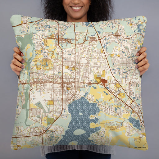 Person holding 22x22 Custom Kissimmee Florida Map Throw Pillow in Woodblock