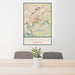 24x36 Knoxville Tennessee Map Print Portrait Orientation in Woodblock Style Behind 2 Chairs Table and Potted Plant