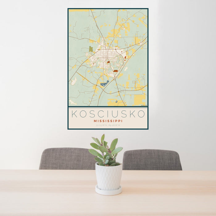 24x36 Kosciusko Mississippi Map Print Portrait Orientation in Woodblock Style Behind 2 Chairs Table and Potted Plant