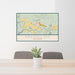 24x36 Kremmling Colorado Map Print Lanscape Orientation in Woodblock Style Behind 2 Chairs Table and Potted Plant