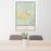 24x36 Kremmling Colorado Map Print Portrait Orientation in Woodblock Style Behind 2 Chairs Table and Potted Plant