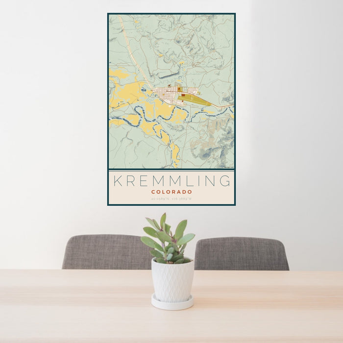 24x36 Kremmling Colorado Map Print Portrait Orientation in Woodblock Style Behind 2 Chairs Table and Potted Plant