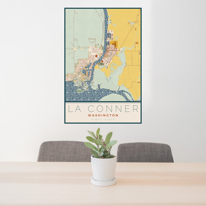 24x36 La Conner Washington Map Print Portrait Orientation in Woodblock Style Behind 2 Chairs Table and Potted Plant