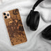 Custom Lafayette Louisiana Map Phone Case in Ember on Table with Black Headphones