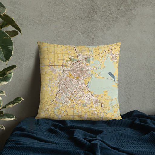 Custom Lafayette Louisiana Map Throw Pillow in Woodblock on Bedding Against Wall