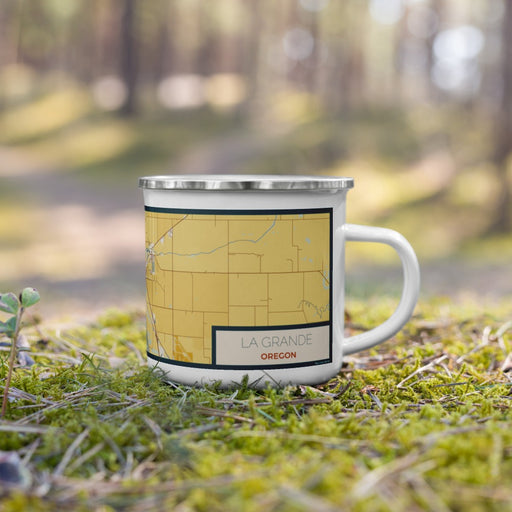 Right View Custom La Grande Oregon Map Enamel Mug in Woodblock on Grass With Trees in Background