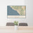 24x36 Laguna Beach California Map Print Landscape Orientation in Woodblock Style Behind 2 Chairs Table and Potted Plant