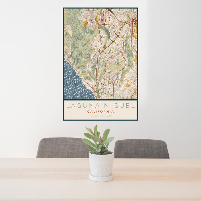 24x36 Laguna Niguel California Map Print Portrait Orientation in Woodblock Style Behind 2 Chairs Table and Potted Plant