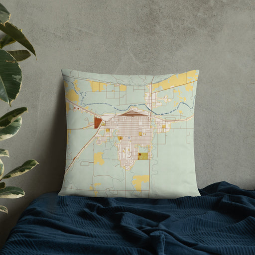 Custom La Junta Colorado Map Throw Pillow in Woodblock on Bedding Against Wall