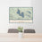 24x36 Lake Almanor California Map Print Lanscape Orientation in Woodblock Style Behind 2 Chairs Table and Potted Plant