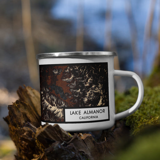 Right View Custom Lake Almanor California Map Enamel Mug in Ember on Grass With Trees in Background