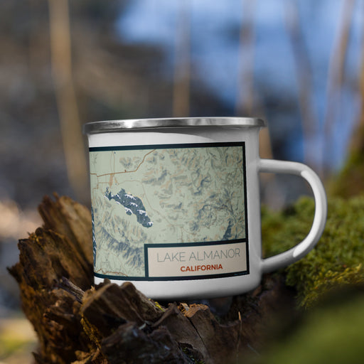 Right View Custom Lake Almanor California Map Enamel Mug in Woodblock on Grass With Trees in Background