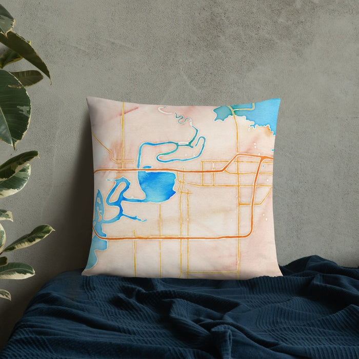 Custom Lake Charles Louisiana Map Throw Pillow in Watercolor on Bedding Against Wall